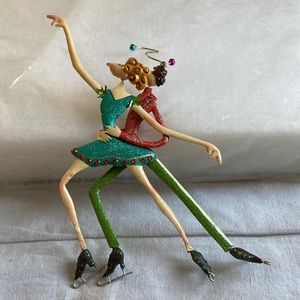 Christmas ornaments of ice skaters. Metal.